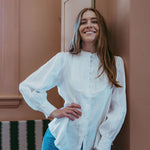 White linen shirt with pintucked bib front, lace trim and puff sleeves, styled with blue jeans — Ada White Linen Shirt by Sorority