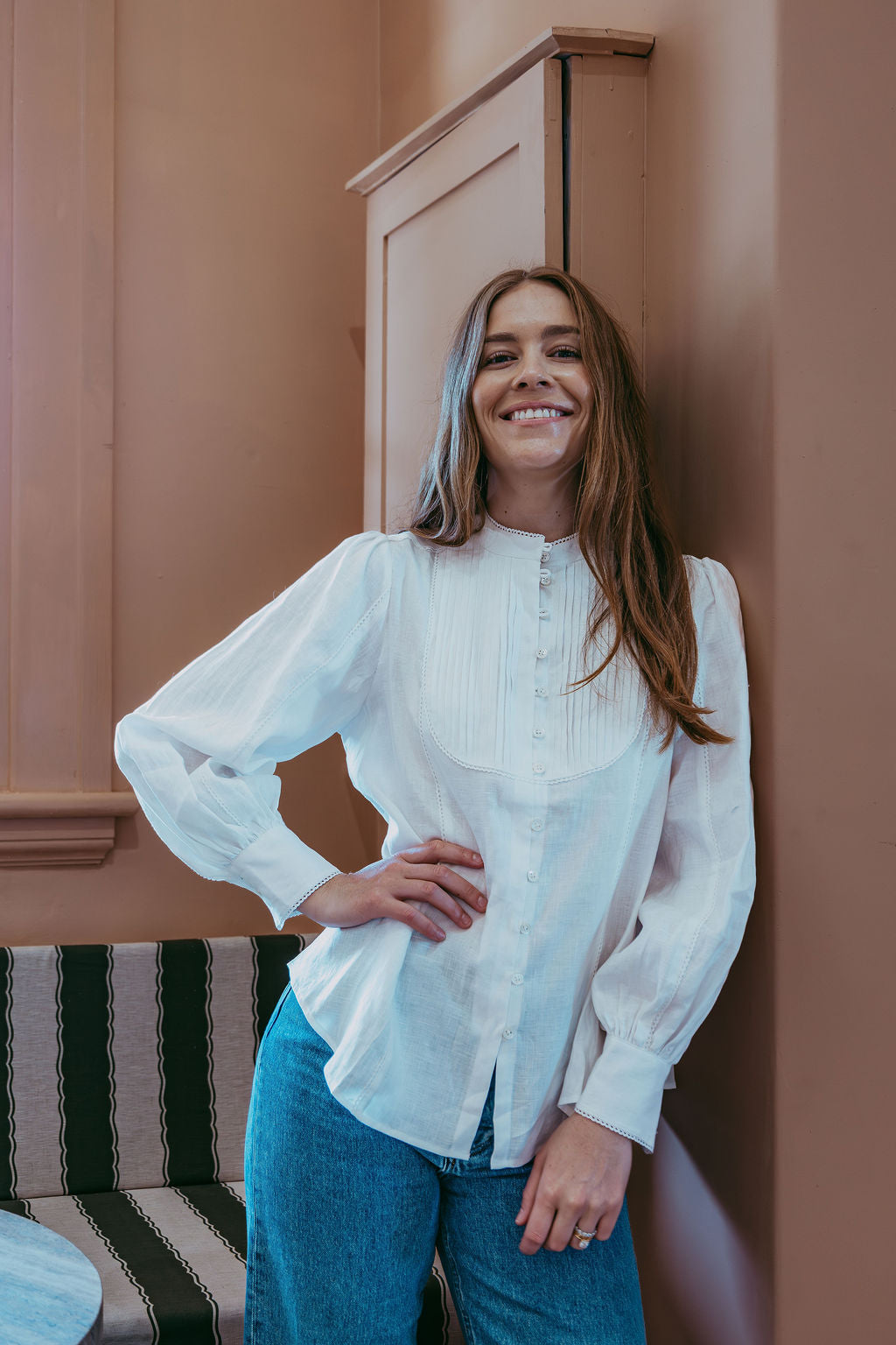 White linen shirt with pintucked bib front, lace trim and puff sleeves, styled with blue jeans — Ada White Linen Shirt by Sorority