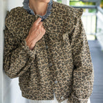 Close up of Peter Pan collared Leopard Print Denim Jacket. Cropped and front buttons