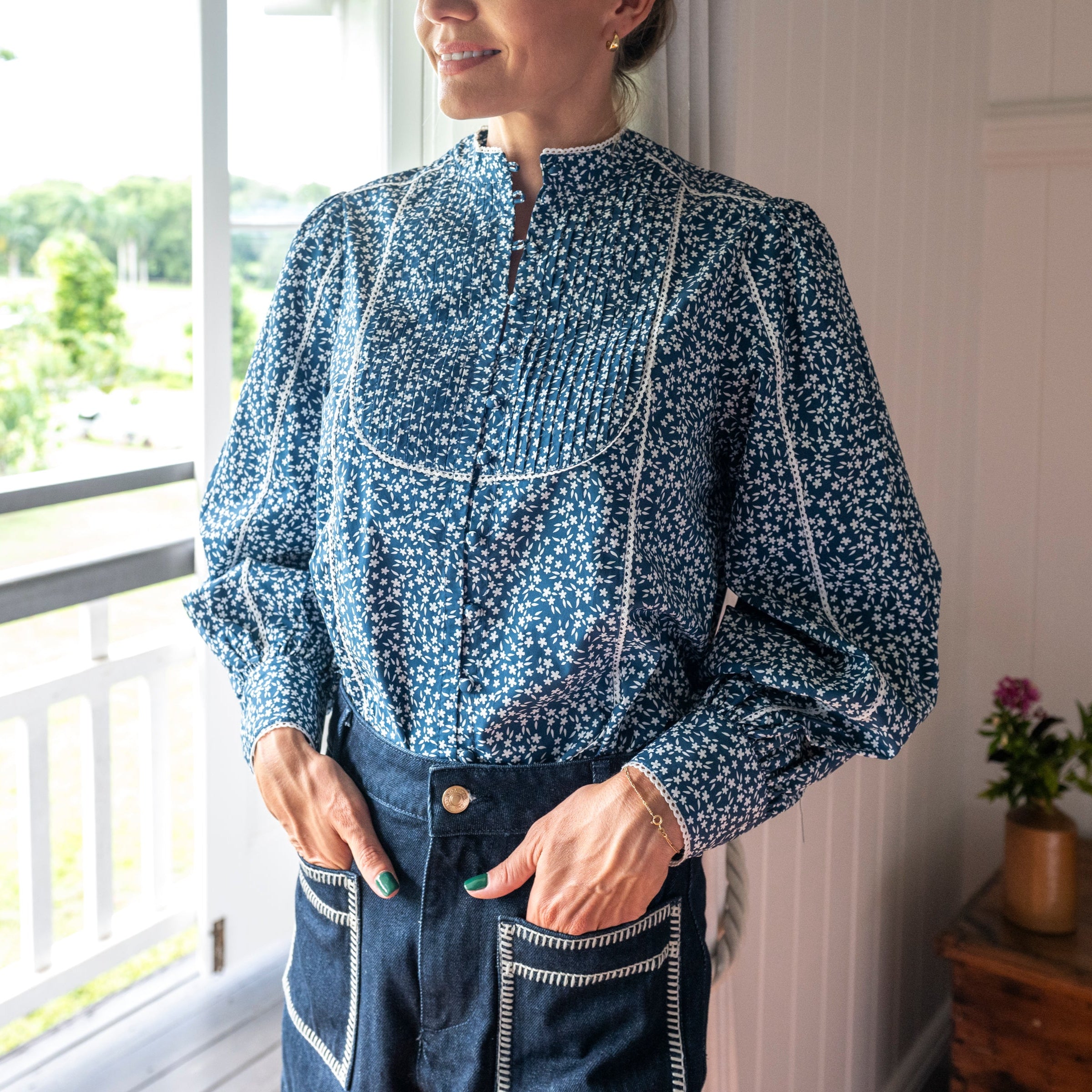 Navy Floral Shirt with white flowers and paired with denim shorts 