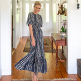 Navy Floral Cotton Maxi dress paired with edges shirred waist and open front
