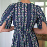 Back view of navy floral cotton dress maxi length