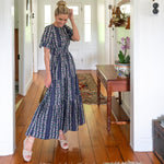 Navy Floral Cotton Maxi dress paired with wedges 