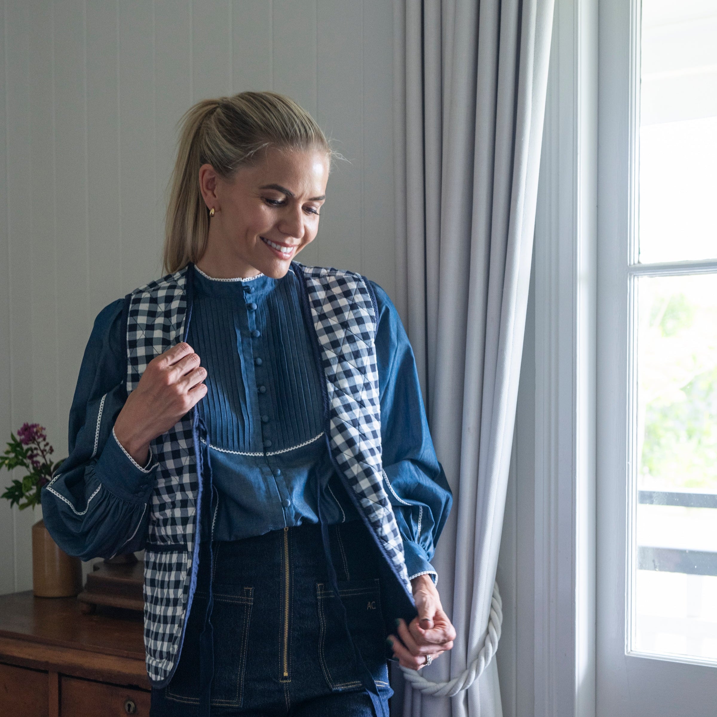 Denim shirt with gingham vest and dark jeans 