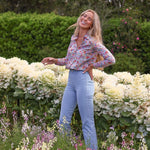 Maeve cotton shirt in Morley Hill Liberty print, distant shot, model in garden