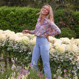 Maeve cotton shirt in Morley Hill Liberty print, distant shot, model in garden