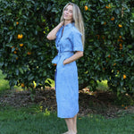 model wearing blue Cybil linen shirt dress, side view, full length