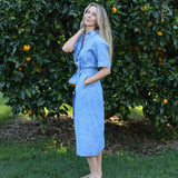 model wearing blue Cybil linen shirt dress, side view, full length