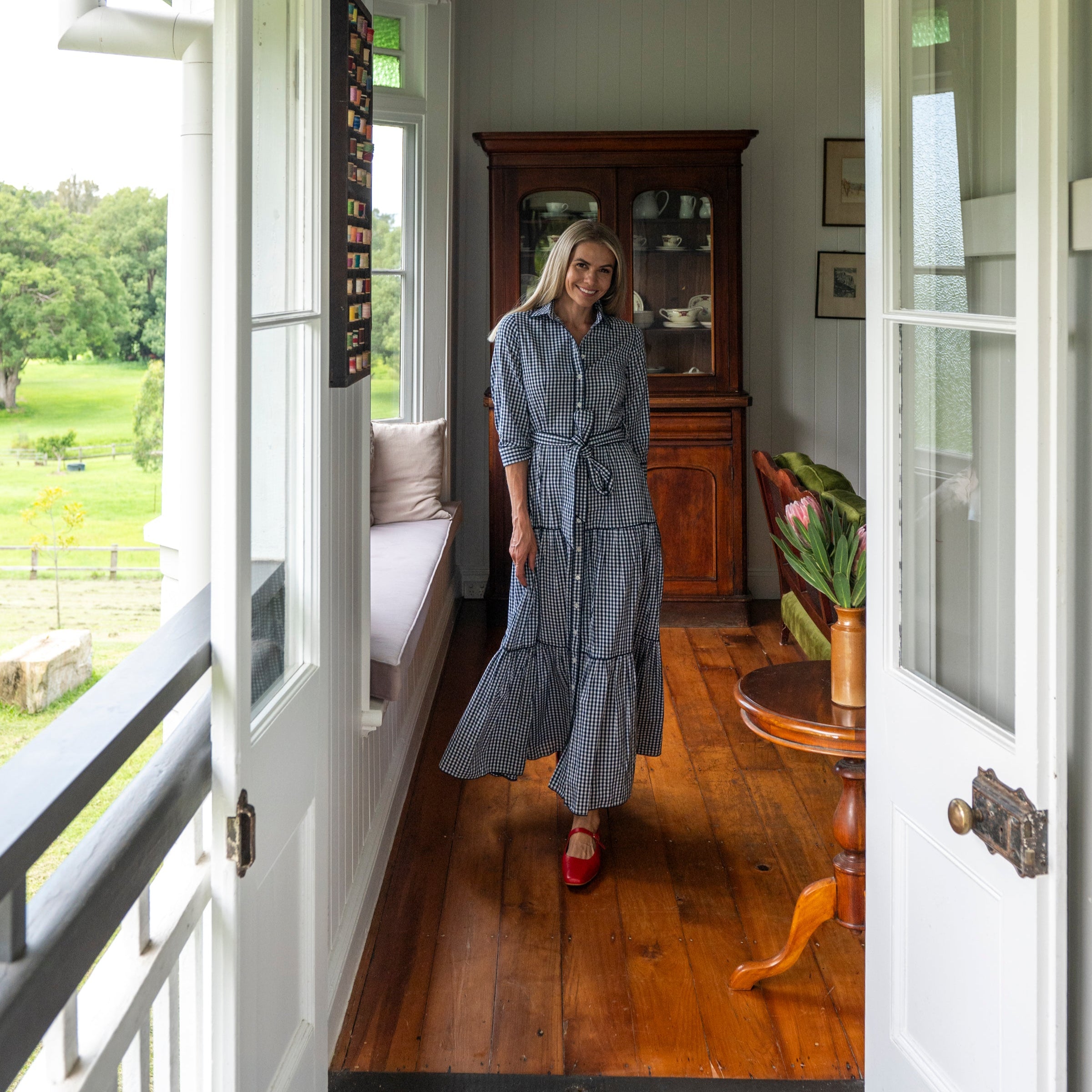 Navy Gingham Cotton Maxi dress with Tie waist and navy lace detail
Red ballet flats and collar with button front full view