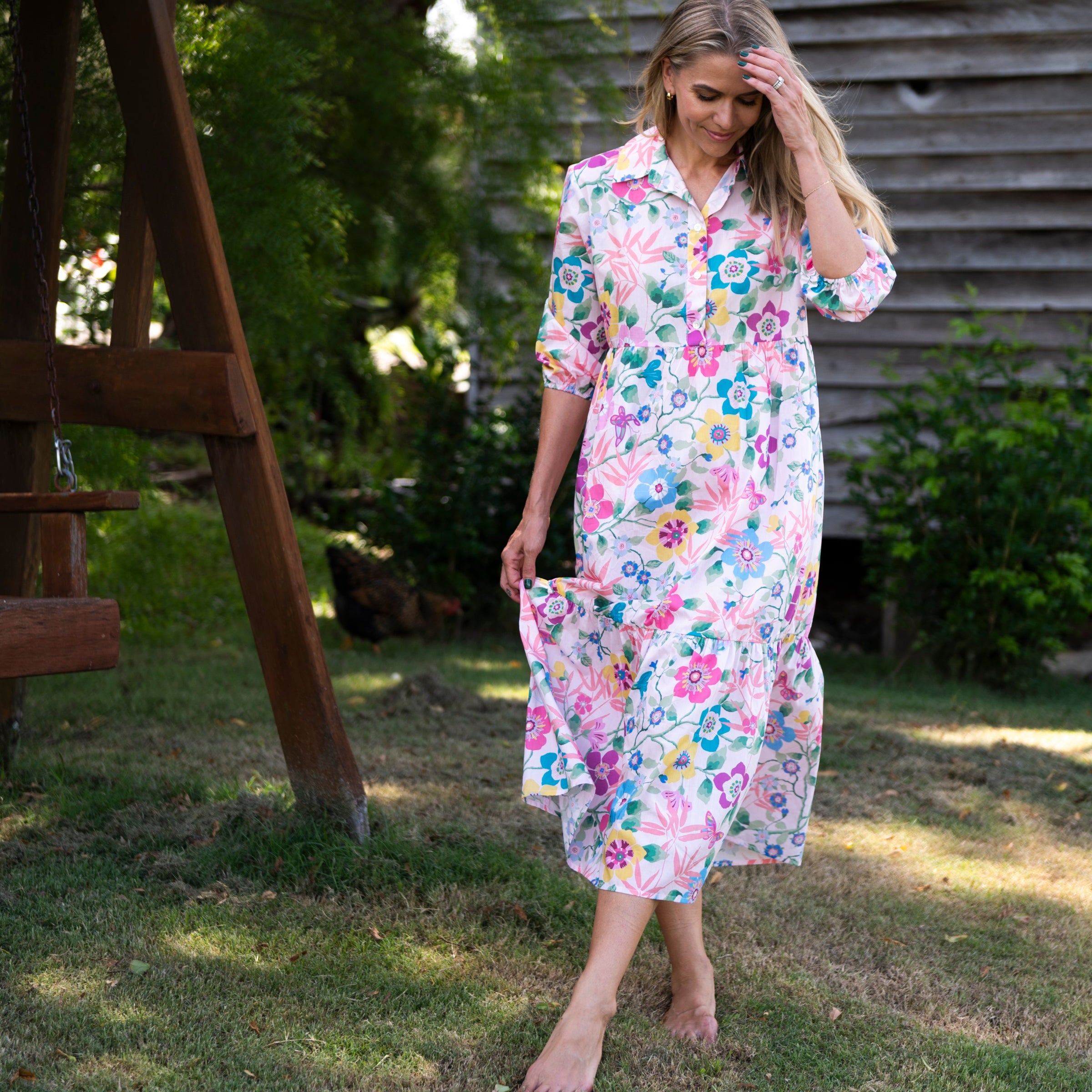 close up of collared tiered mazxi dress in large floral print from cotton by Liberty fabrics