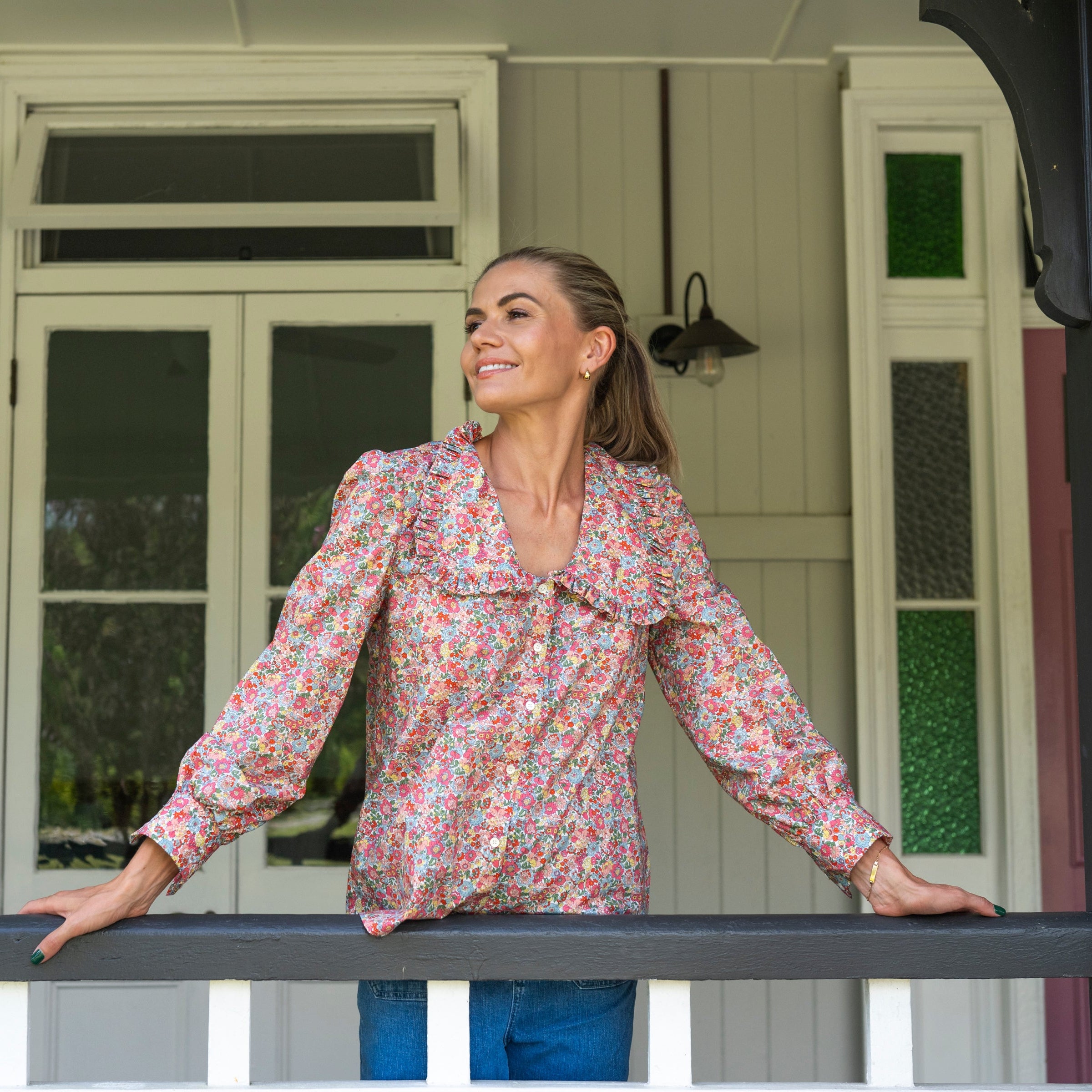 Chelsea Collared Liberty Fabrics Floral Blouse with full buttons paired with jeans