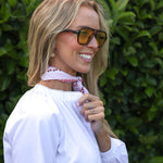 model wearing Valerie white cotton shirt with lace trim, side view